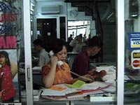 Ann at work in the early Ann Tours office in Ho Chi Minh City
