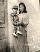 Ann holding her son Tony as a toddler